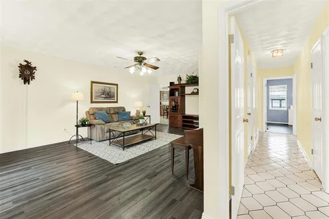 a view of a livingroom with furniture and wooden floor