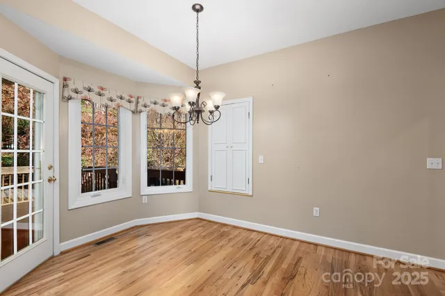 a bathroom with a bathtub and a window