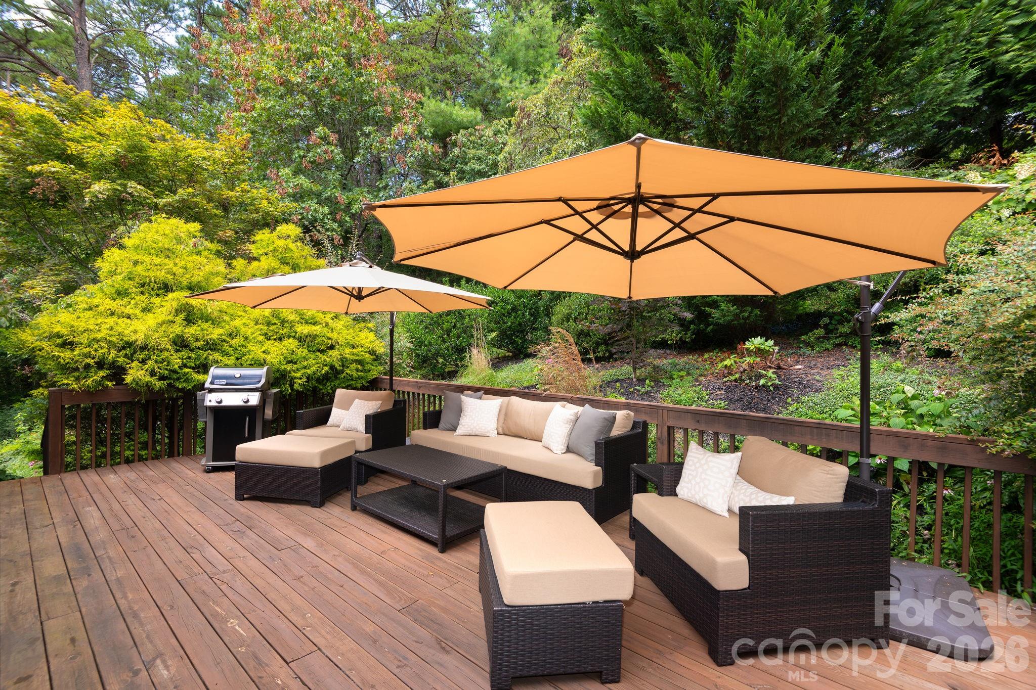 212 Blue Ridge Vista Asheville, NC 28805 - Photo 23 of 42 an outdoor sitting area with furniture and wooden deck