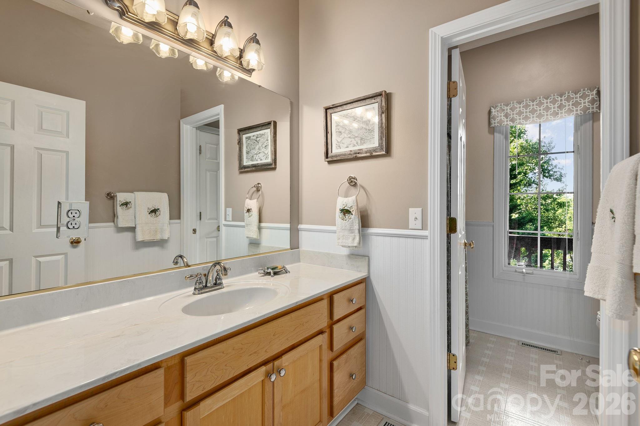 212 Blue Ridge Vista Asheville, NC 28805 - Photo 27 of 42 a bathroom with a sink and a mirror