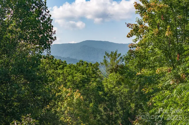 a view of a two chairs in the balcony