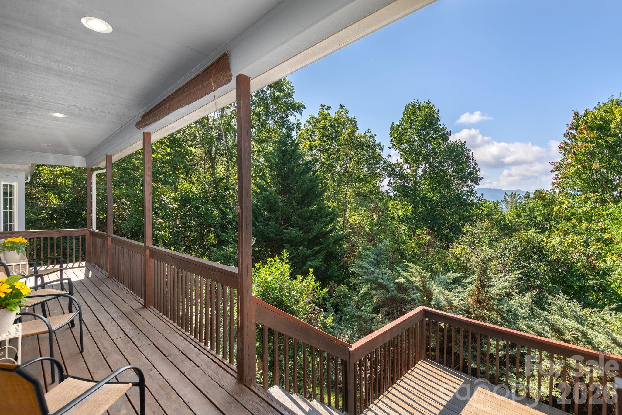 212 Blue Ridge Vista Asheville, NC 28805 - Photo 4 of 42 a view of a two chairs in the balcony