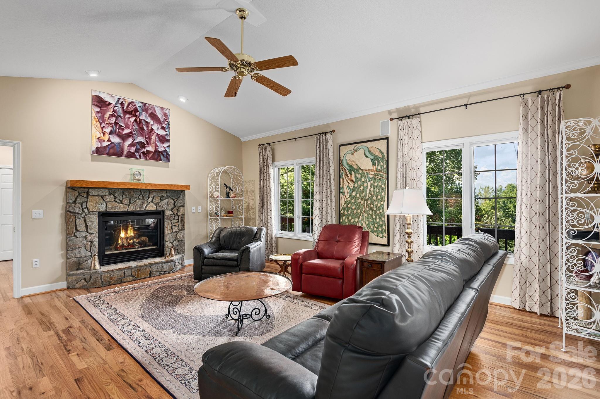 212 Blue Ridge Vista Asheville, NC 28805 - Photo 7 of 42 a living room with furniture and a fireplace