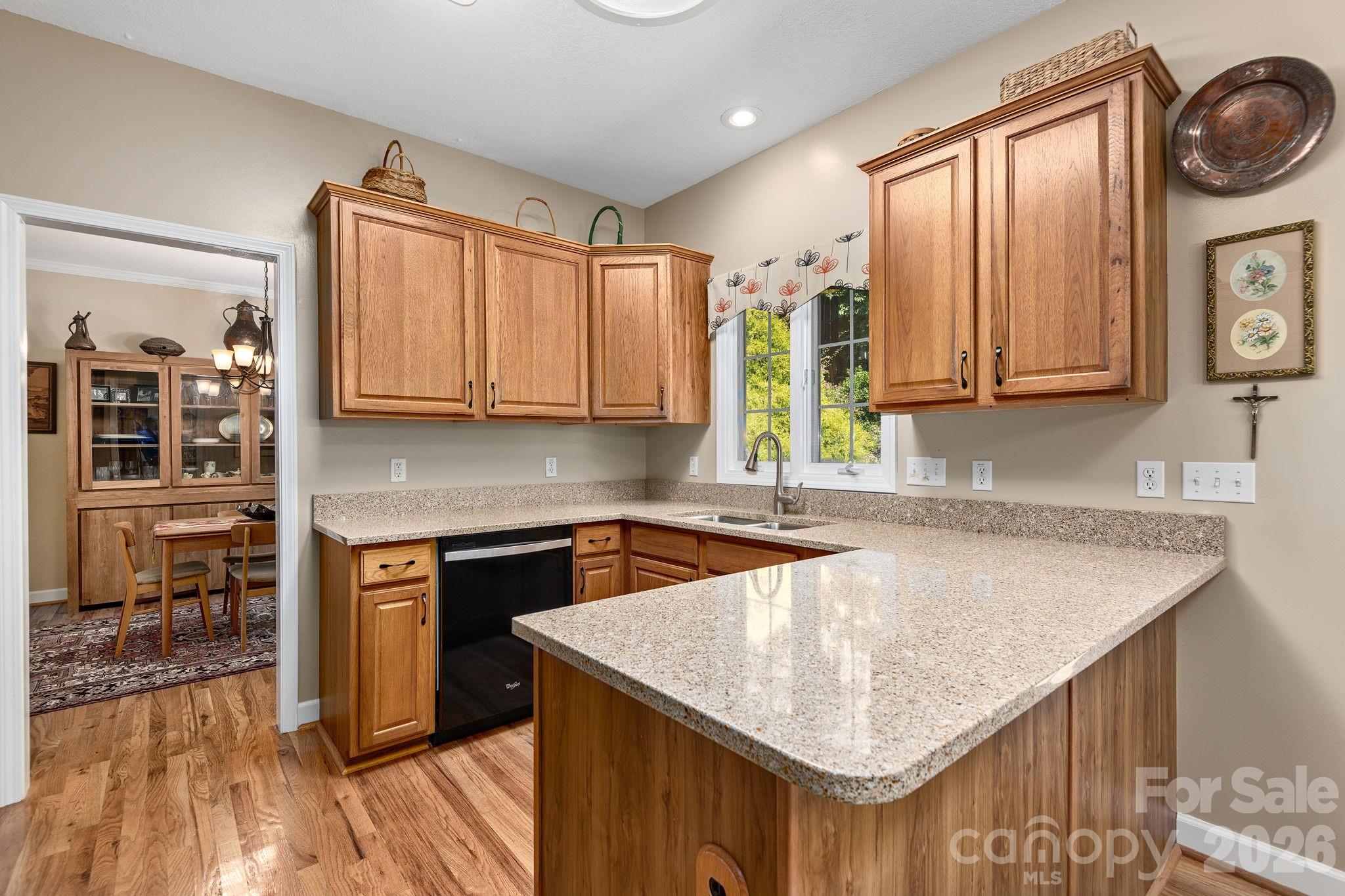 212 Blue Ridge Vista Asheville, NC 28805 - Photo 9 of 42 a kitchen with stainless steel appliances granite countertop a kitchen island a stove a sink and a microwave