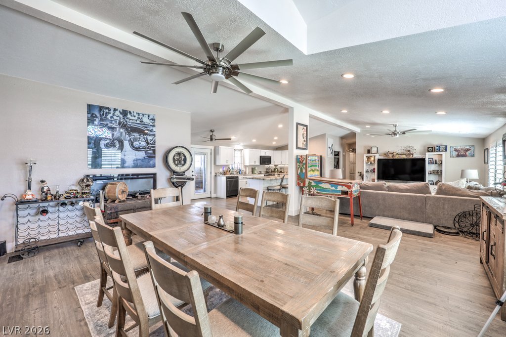 4375 Pinwheel Street Logandale, NV 89021 - Photo 15 of 52 An open concept design seamlessly connects the dining room to the kitchen and living areas, perfect for entertaining.