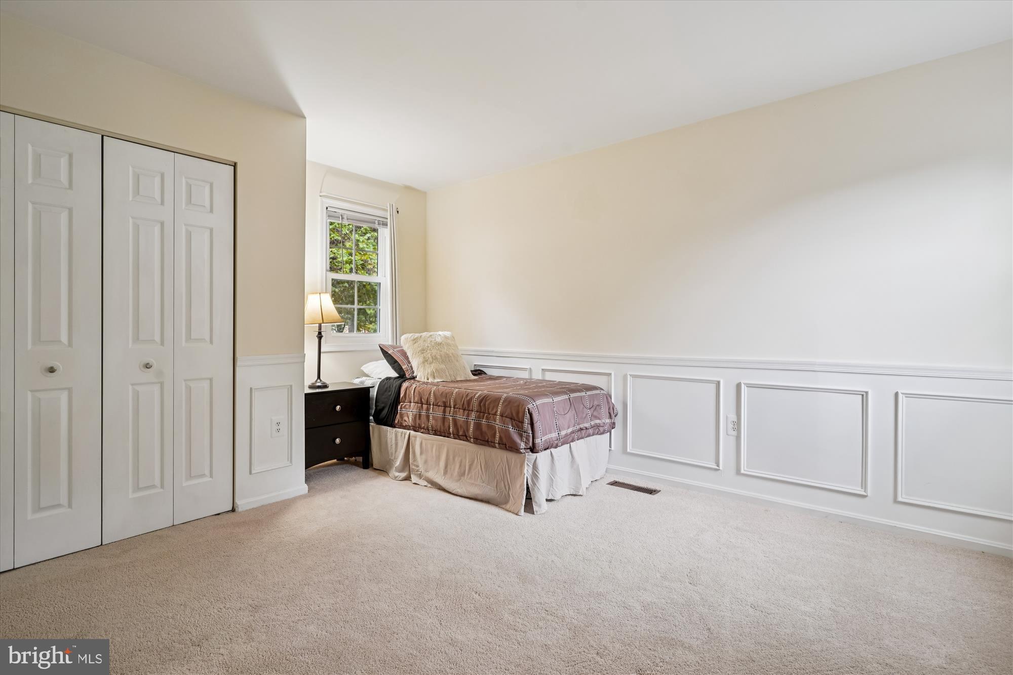14511 Colonels Choice Road Upper Marlboro, MD 20772 - Photo 24 of 41 a spacious bedroom with a bed and a window