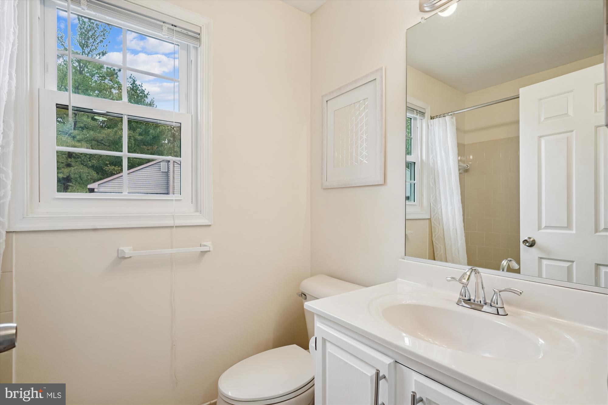 14511 Colonels Choice Road Upper Marlboro, MD 20772 - Photo 26 of 41 a bathroom with a sink toilet and mirror