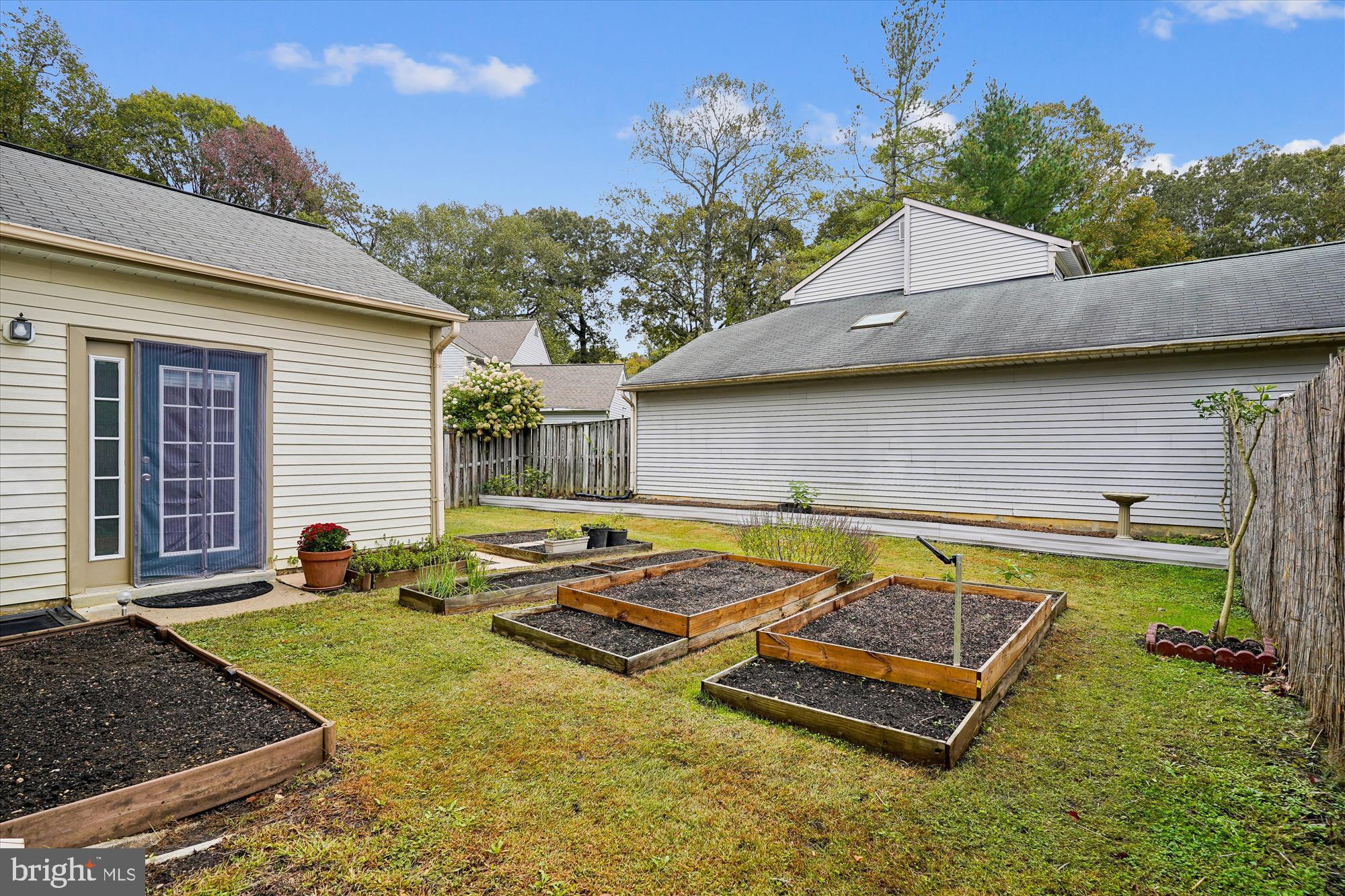 14511 Colonels Choice Road Upper Marlboro, MD 20772 - Photo 30 of 41 a view of a house with swimming pool and sitting area