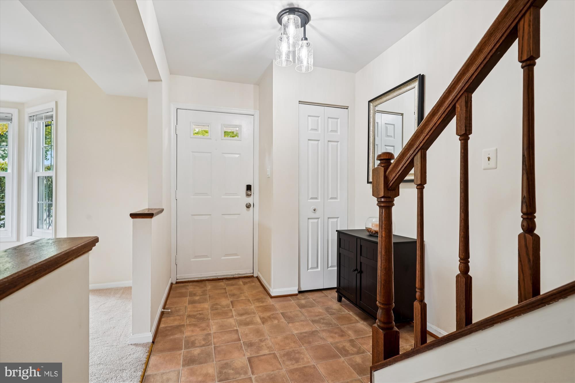 14511 Colonels Choice Road Upper Marlboro, MD 20772 - Photo 4 of 41 a view of a hallway with wooden floor and staircase
