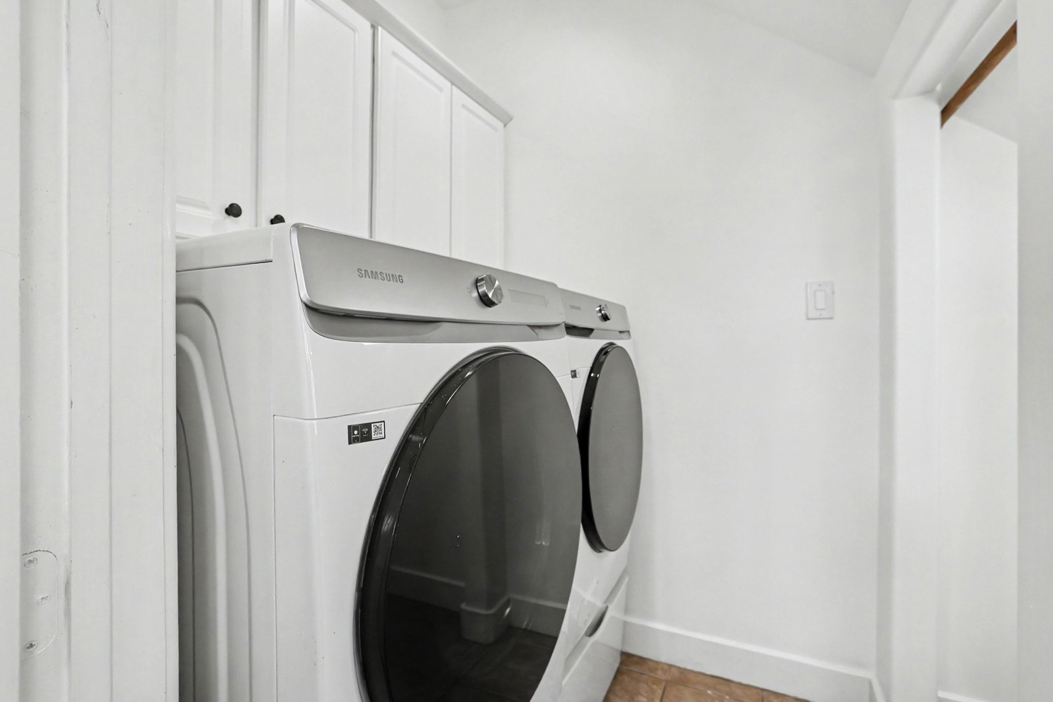 1470 Springrock Lane, Unit 6 Houston, TX 77055 - Photo 26 of 31 Laundry room on the first floor with extra storage space. Washer and dryer included.