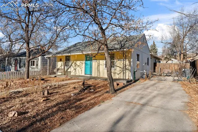 a view of backyard with large trees