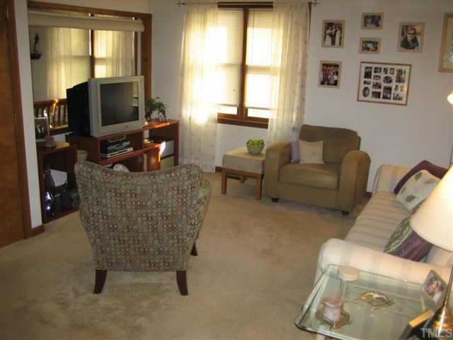 3642 Mill Run Raleigh, NC 27612 - Photo 3 of 10 a living room with furniture and a flat screen tv