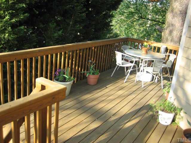 3642 Mill Run Raleigh, NC 27612 - Photo 10 of 10 a balcony with wooden floor and outdoor seating