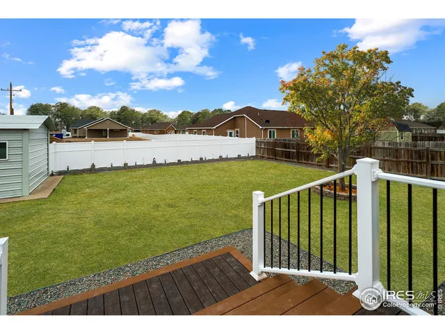 a view of outdoor space and yard with ocean view