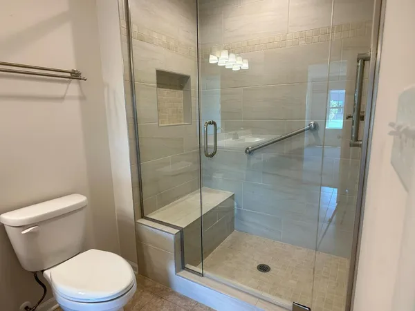 a bathroom with a shower and toilet