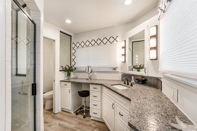 a kitchen with a sink stove and refrigerator
