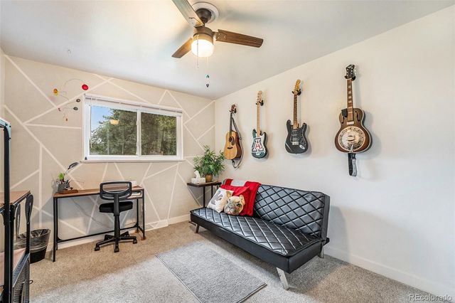 a view of a livingroom with furniture and a window