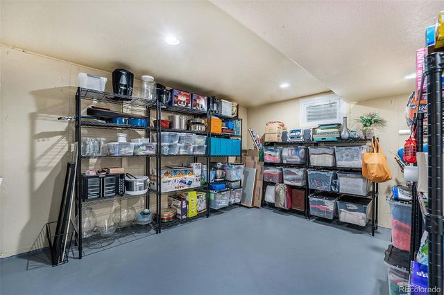 a room with storage and a white walls