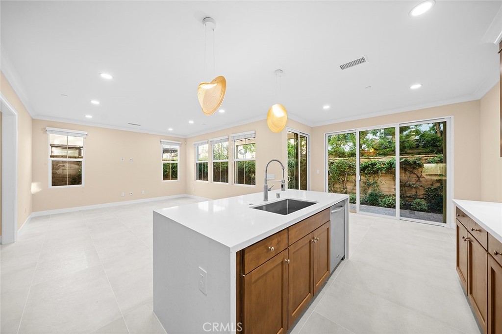 143 Rodeo Irvine, CA 92602 - Photo 5 of 37 a kitchen that has a sink and a large window