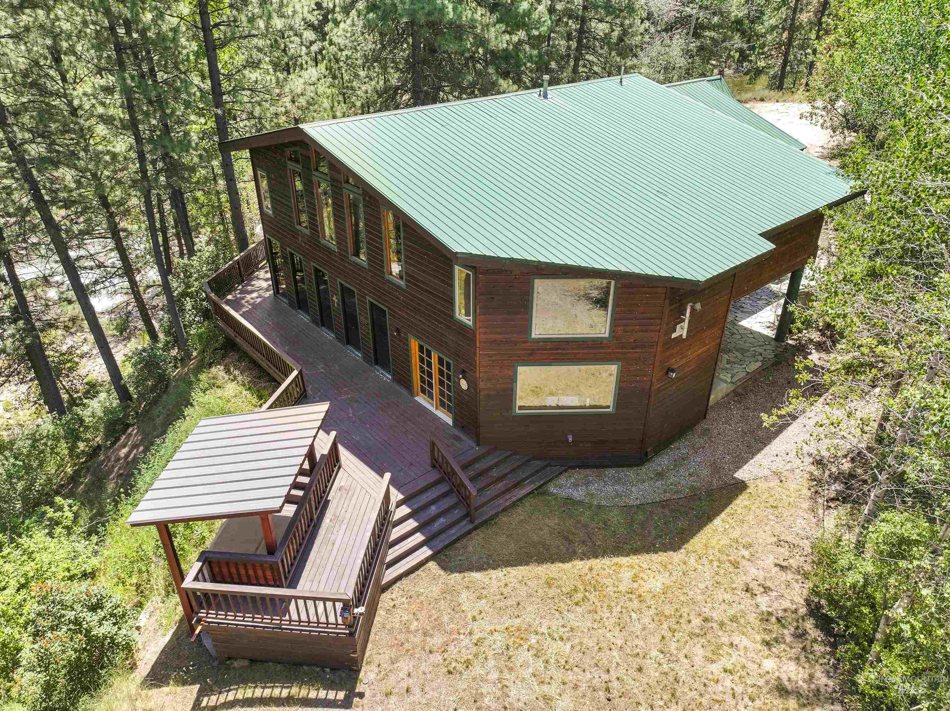 224 Dakota Road Mountain Home, ID 83647 - Photo 49 of 50 Multi-level home featuring a green metal roof and wood siding