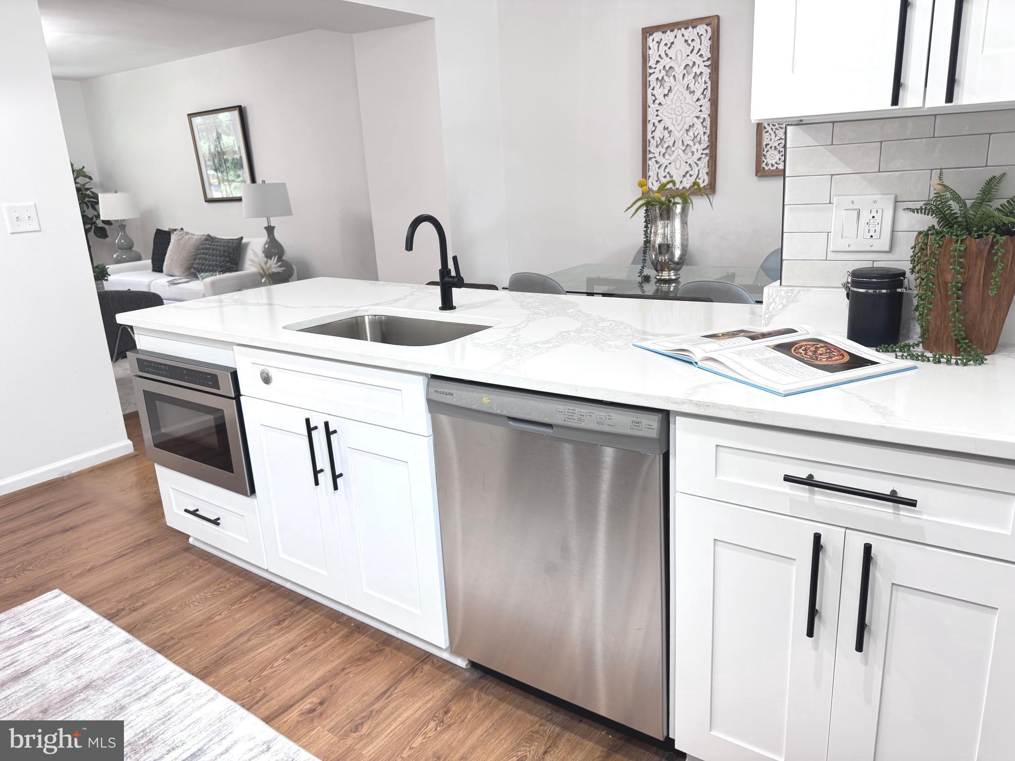 48 Girard Street Northeast Washington, DC 20002 - Photo 11 of 43 a kitchen with a sink and a refrigerator