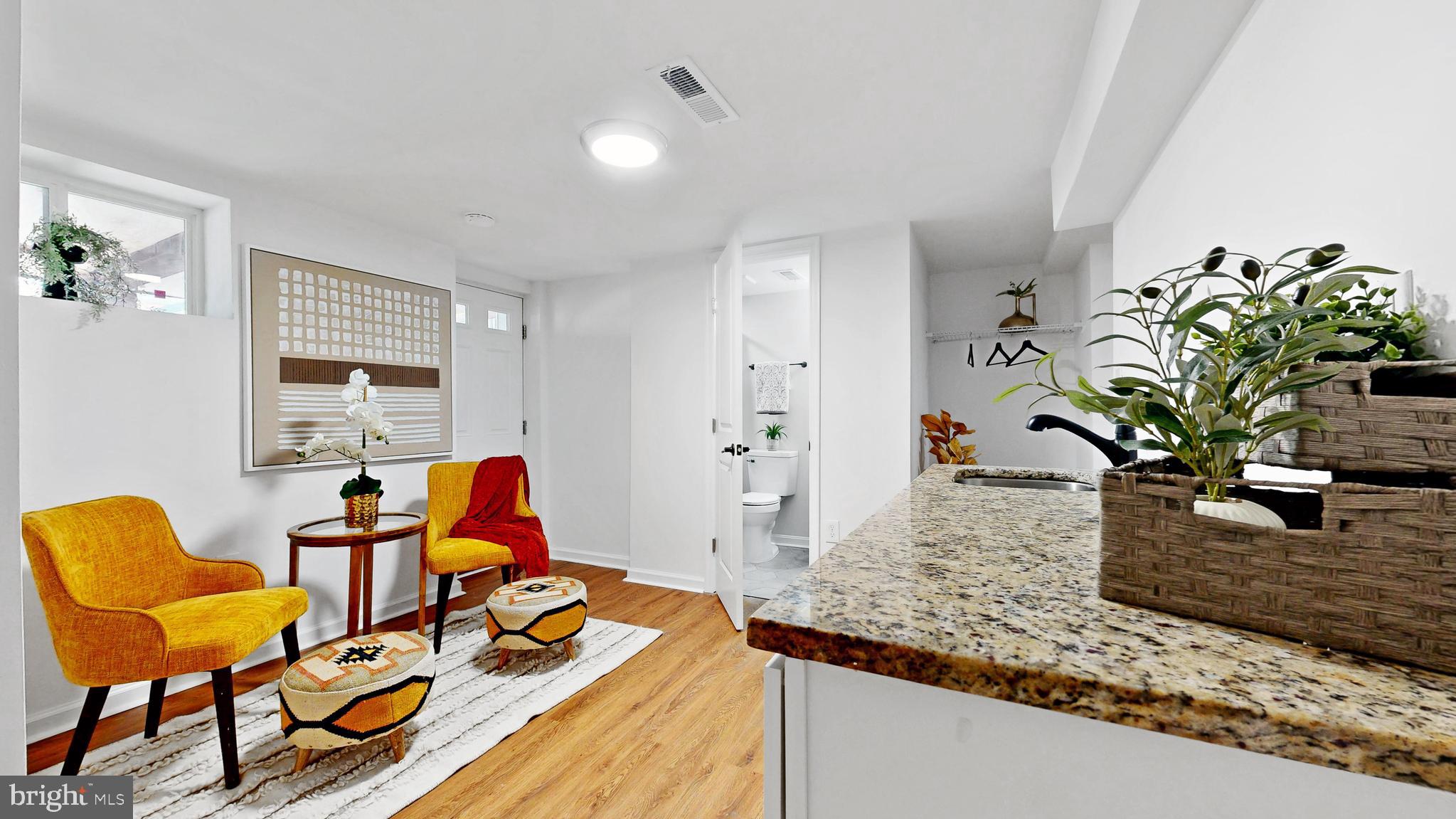 48 Girard Street Northeast Washington, DC 20002 - Photo 15 of 43 a dining room with furniture and wooden floor