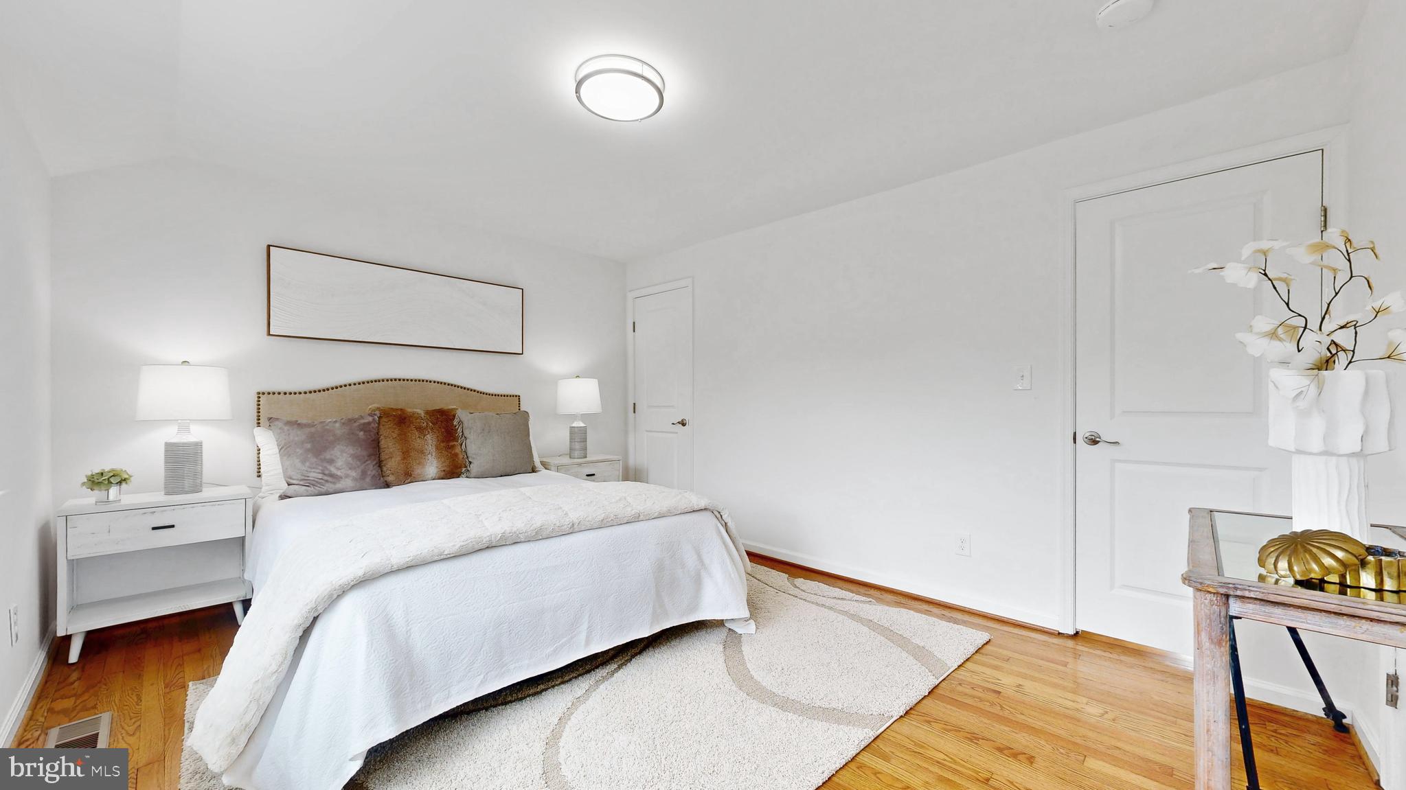 48 Girard Street Northeast Washington, DC 20002 - Photo 19 of 43 a bedroom with a bed and lamps