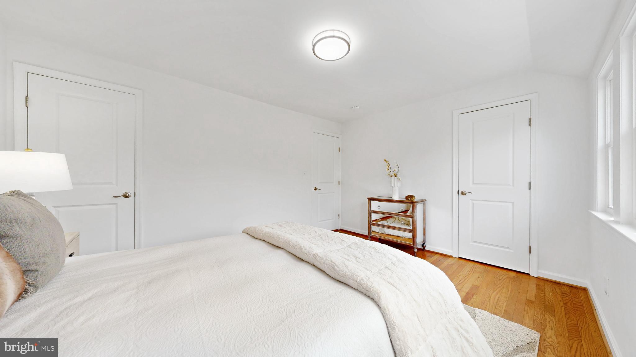 48 Girard Street Northeast Washington, DC 20002 - Photo 21 of 43 a bedroom with a bed and a lamp