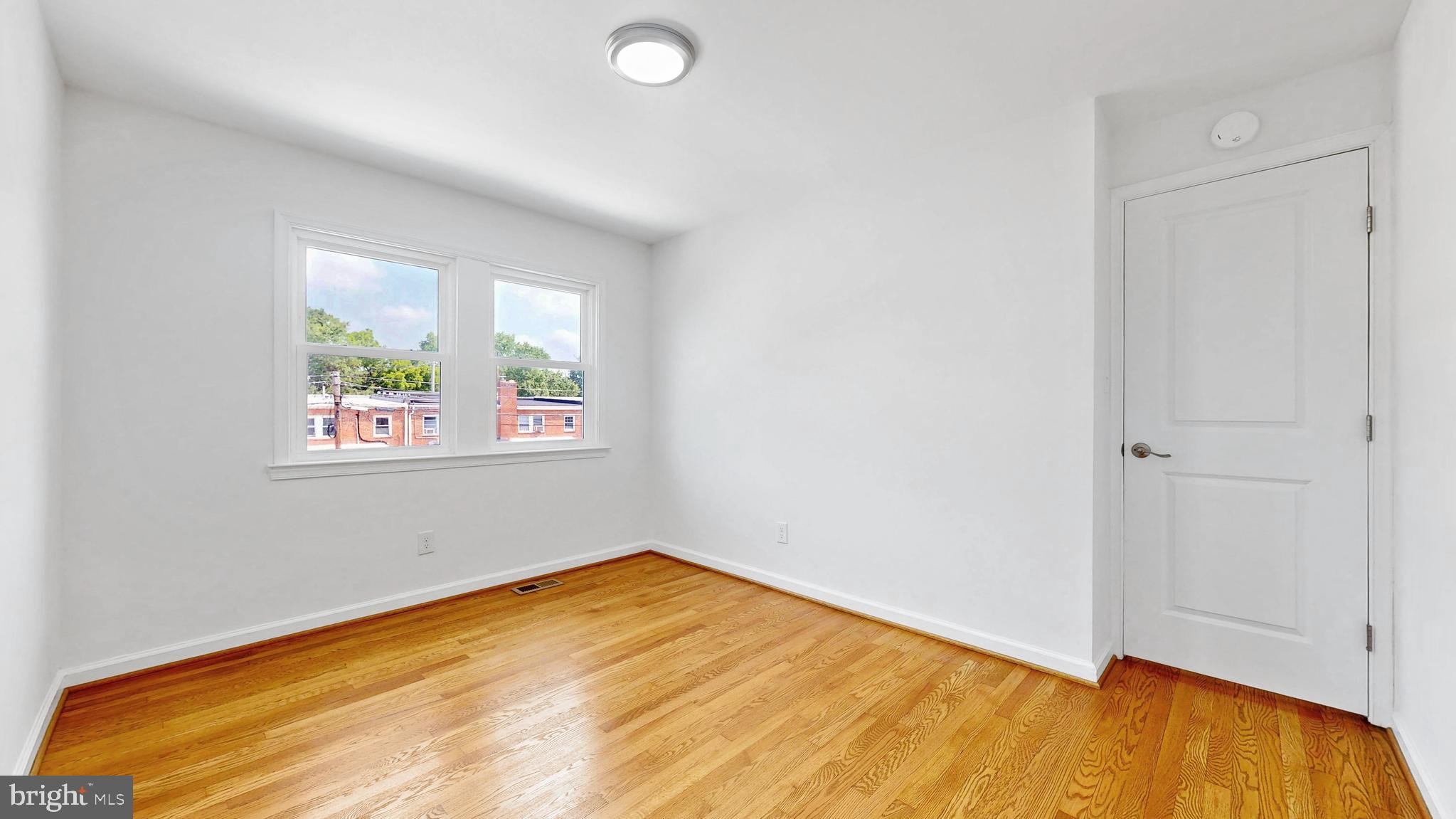 48 Girard Street Northeast Washington, DC 20002 - Photo 24 of 43 wooden floor in an empty room