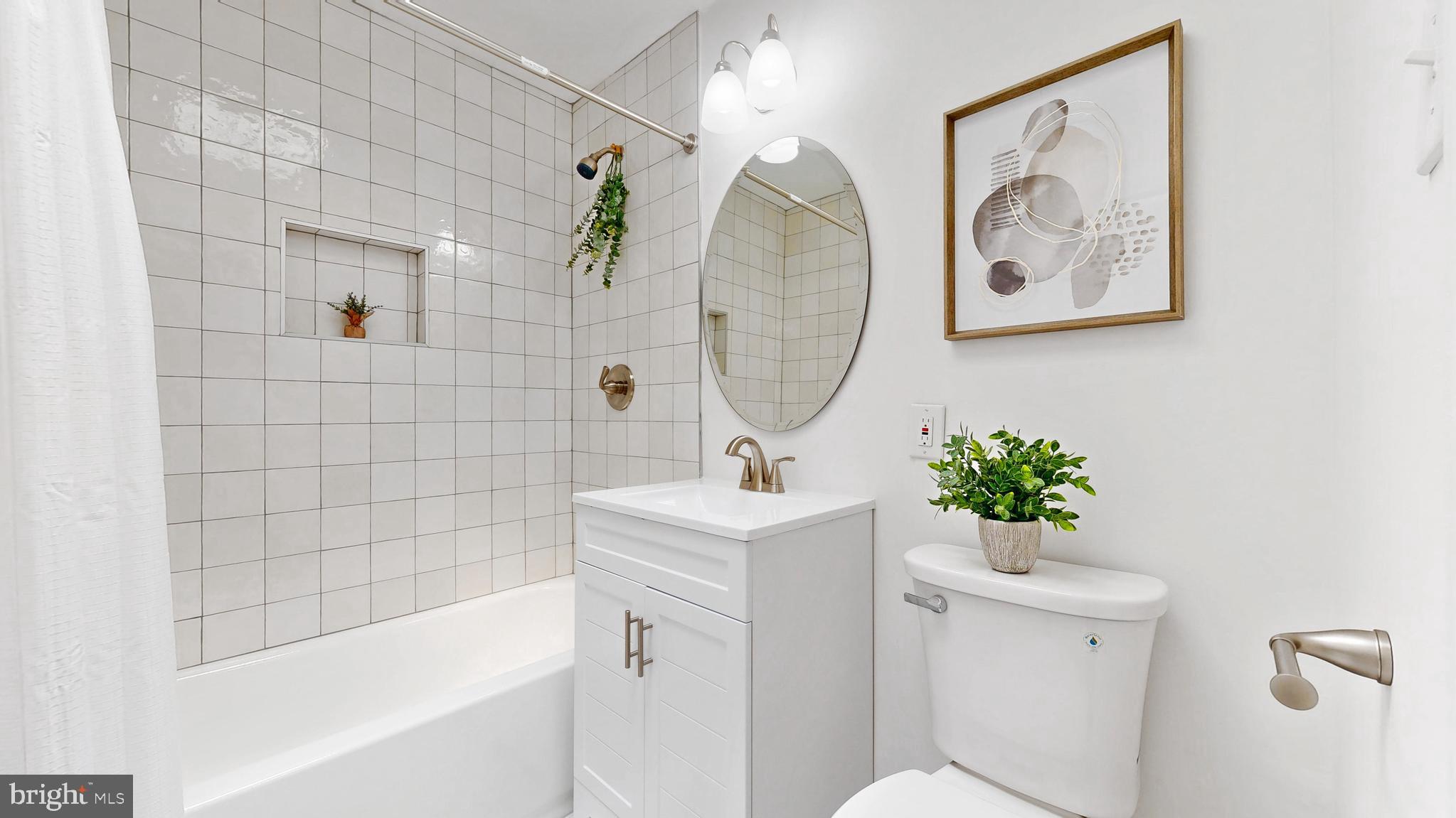 48 Girard Street Northeast Washington, DC 20002 - Photo 27 of 43 a bathroom with a sink toilet and shower
