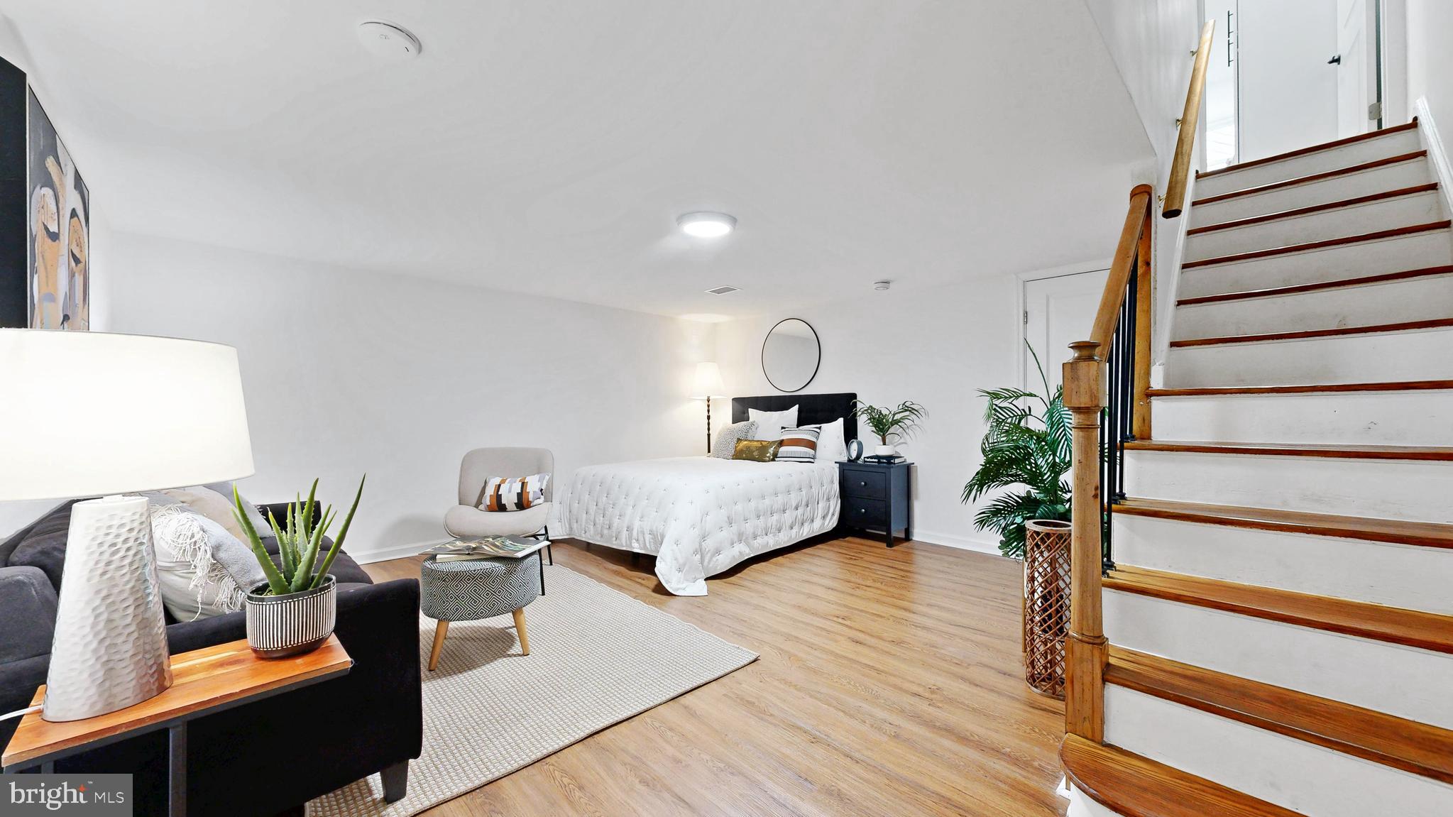 48 Girard Street Northeast Washington, DC 20002 - Photo 28 of 43 a living room with furniture and wooden floor