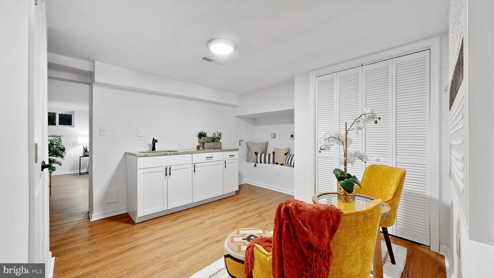 48 Girard Street Northeast Washington, DC 20002 - Photo 32 of 43 a living room with furniture and a wooden floor