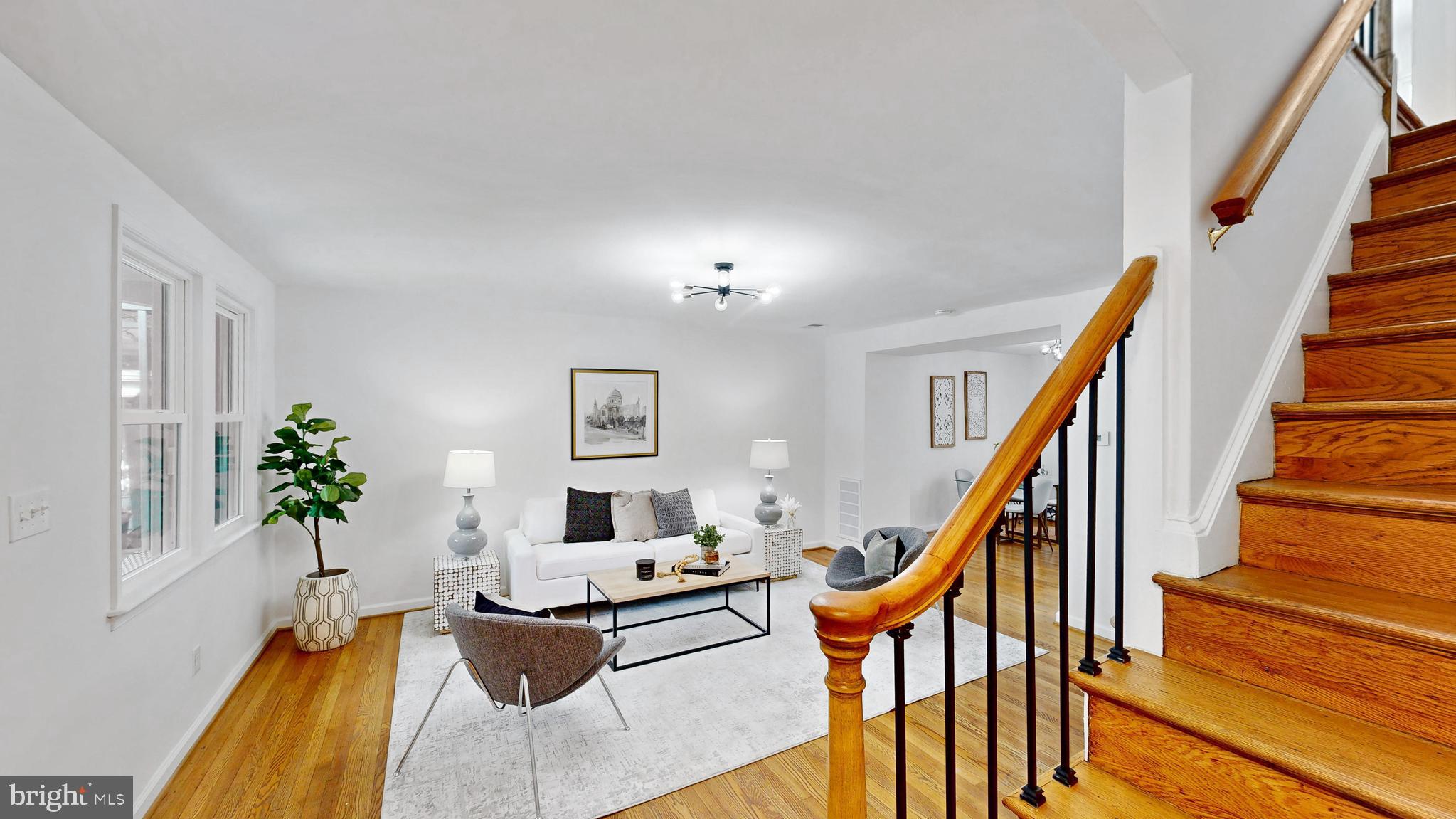 48 Girard Street Northeast Washington, DC 20002 - Photo 34 of 43 a living room with furniture and stairs