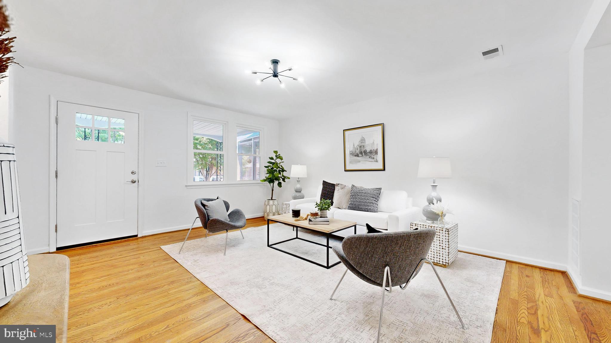 48 Girard Street Northeast Washington, DC 20002 - Photo 35 of 43 a living room with furniture and wooden floor