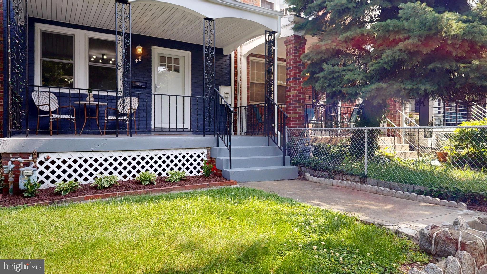 48 Girard Street Northeast Washington, DC 20002 - Photo 36 of 43 a view of a yard with a bench
