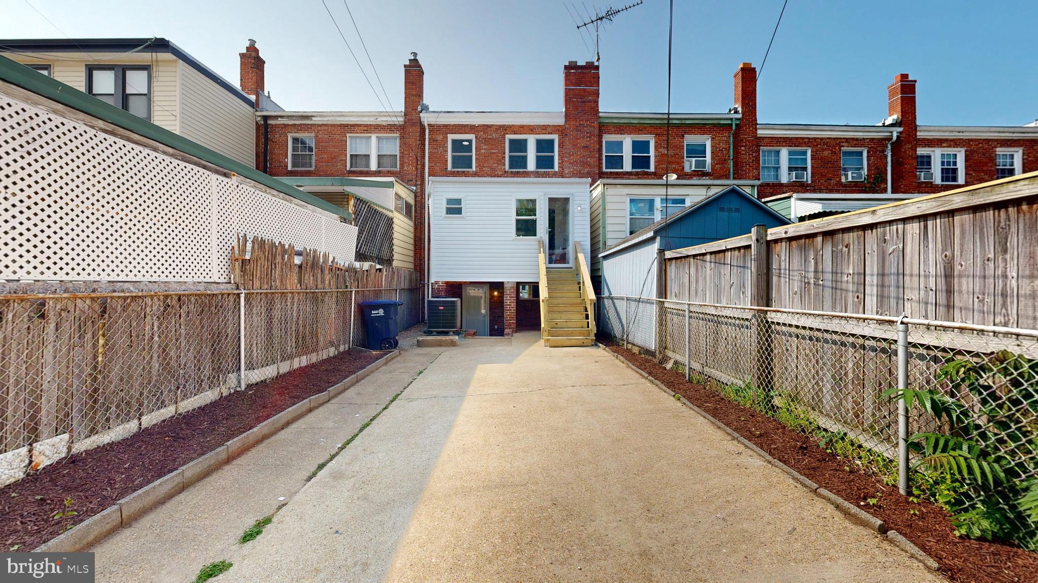 48 Girard Street Northeast Washington, DC 20002 - Photo 38 of 43 a view of a brick house with many windows
