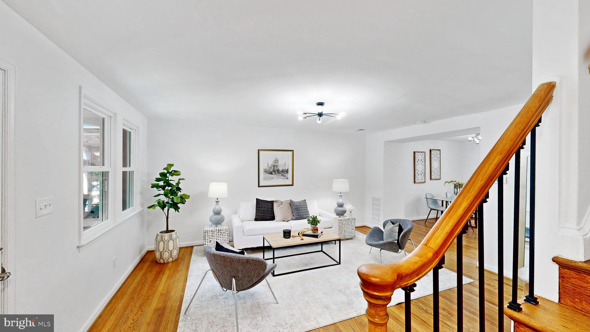 48 Girard Street Northeast Washington, DC 20002 - Photo 8 of 43 a living room with furniture and a wooden floor