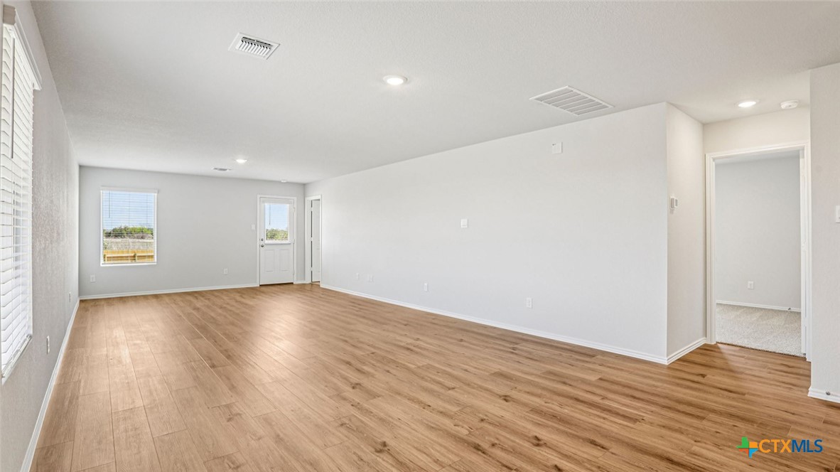 1303 Newey Circle Temple, TX 76504 - Photo 11 of 33 a view of an empty room with wooden floor and closet