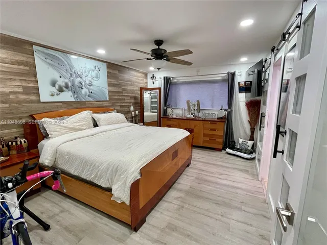 a bed room with a bed and a walk in closet