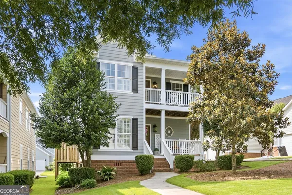 front view of a house with a garden