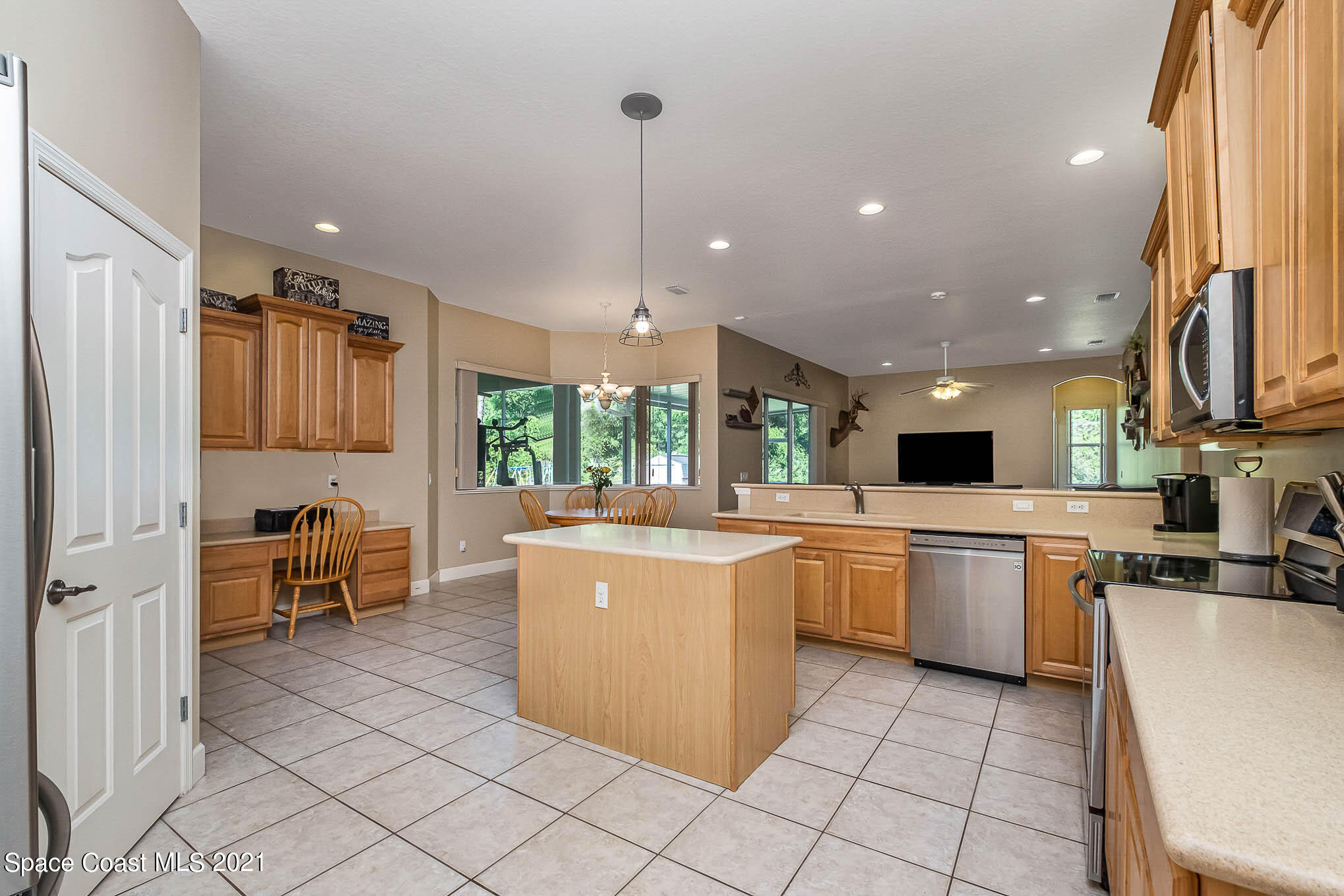 4329 Hunter Road Mims, FL 32754 - Photo 11 of 35 a kitchen with kitchen island granite countertop lots of counter top space