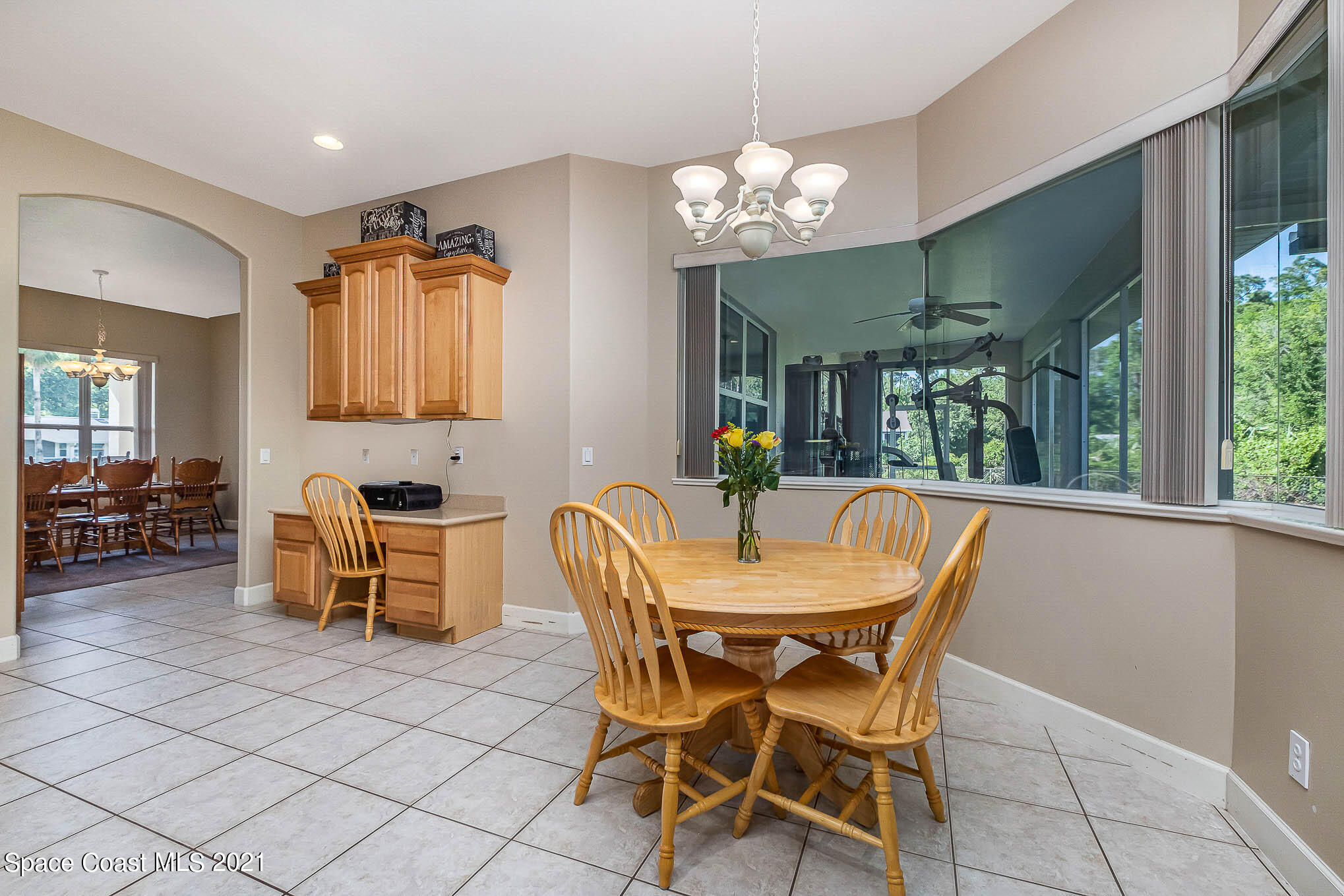 4329 Hunter Road Mims, FL 32754 - Photo 13 of 35 a view of a dining room with furniture and a chandelier