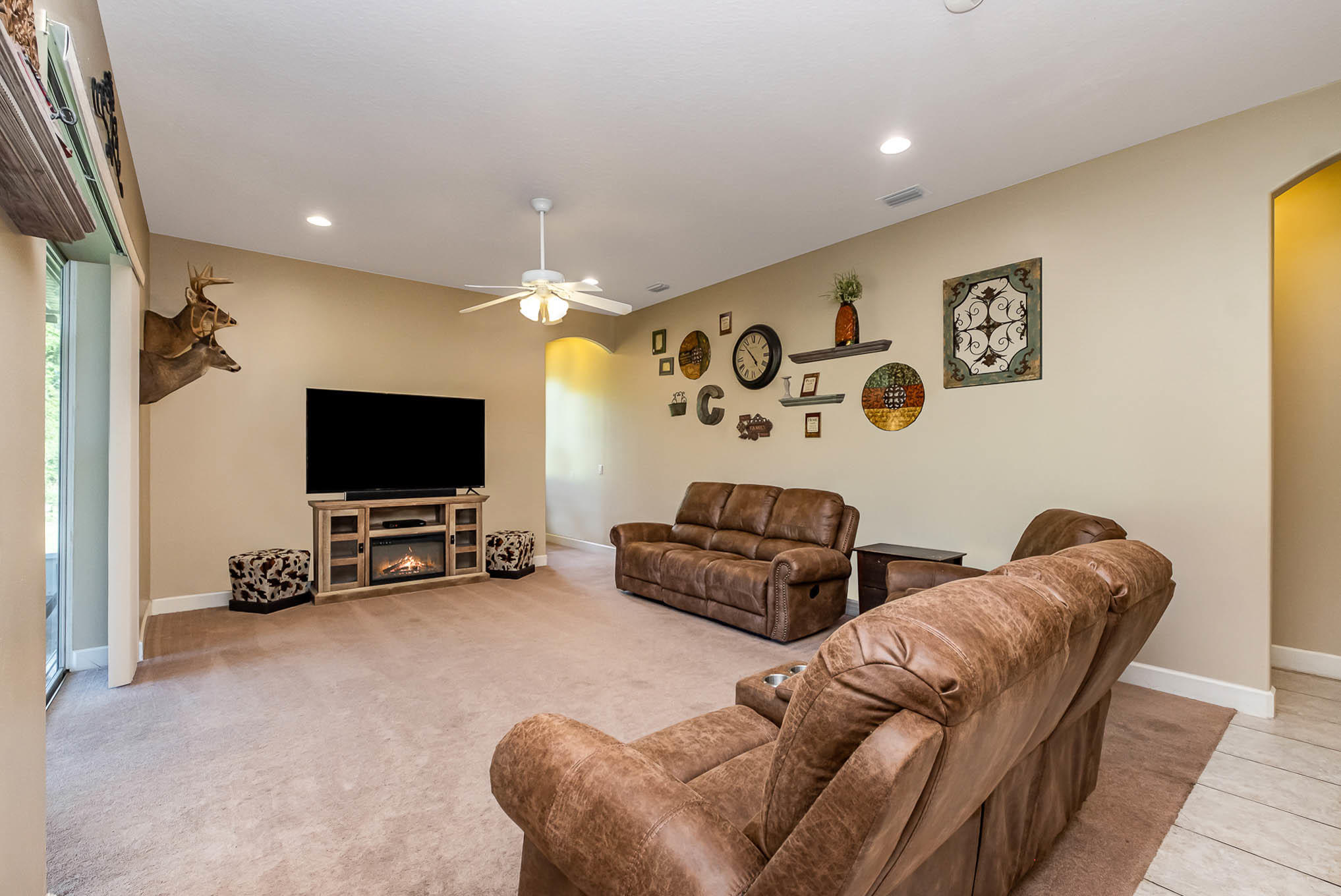 4329 Hunter Road Mims, FL 32754 - Photo 15 of 35 a living room with furniture and a flat screen tv