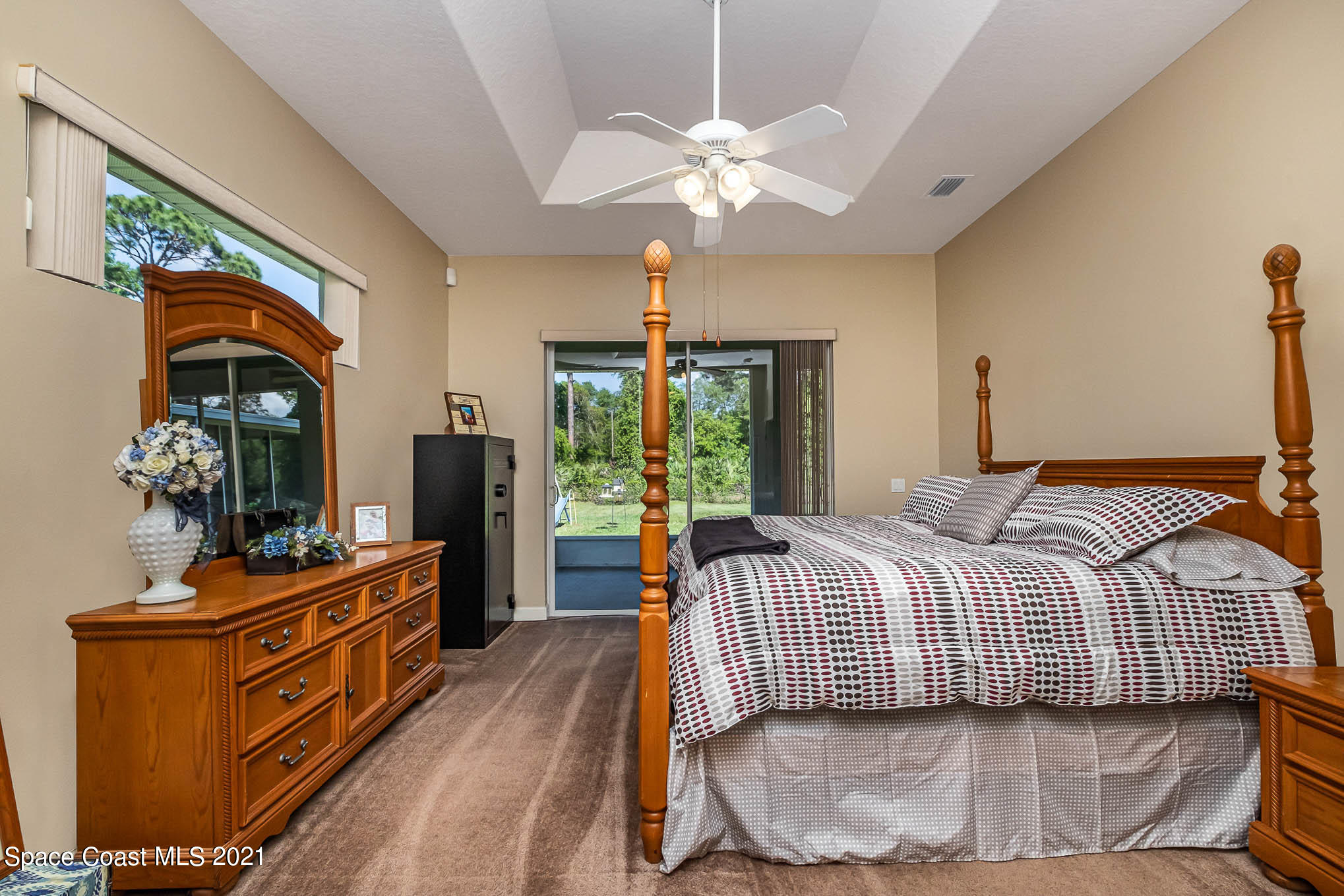 4329 Hunter Road Mims, FL 32754 - Photo 18 of 35 a bedroom with a bed and wooden floor