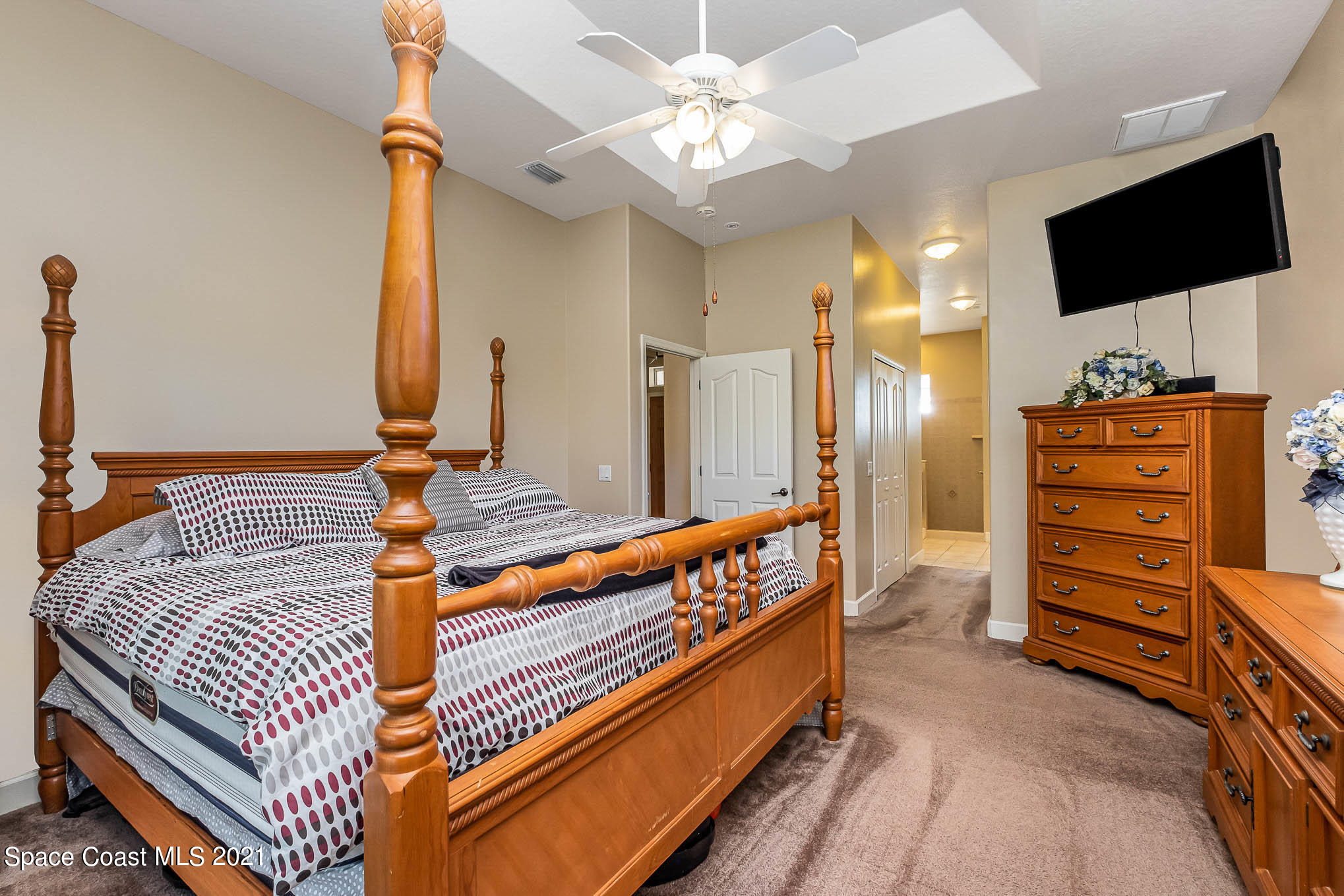 4329 Hunter Road Mims, FL 32754 - Photo 19 of 35 a bedroom with furniture and a flat screen tv