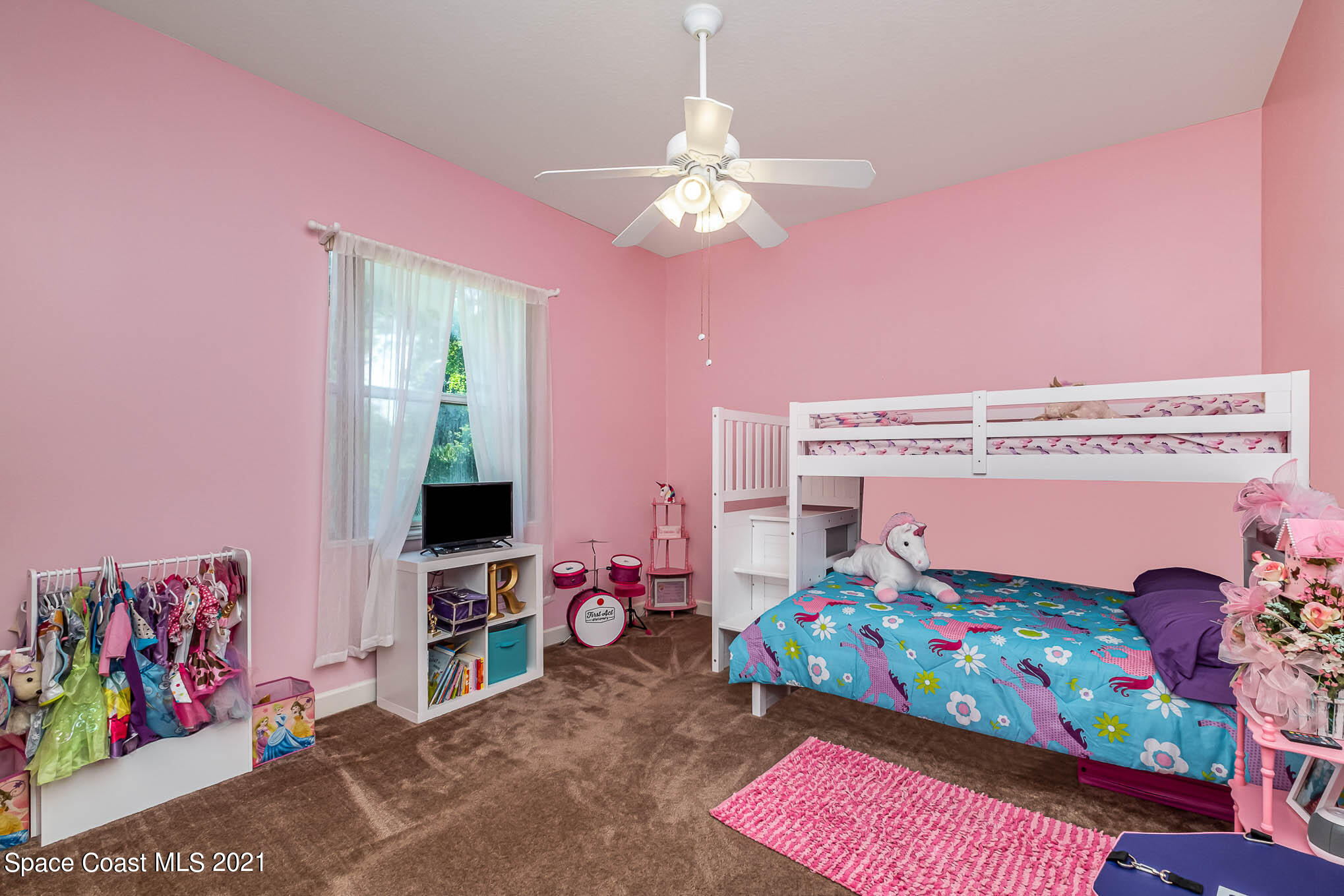 4329 Hunter Road Mims, FL 32754 - Photo 23 of 35 a bedroom with a bed and a window