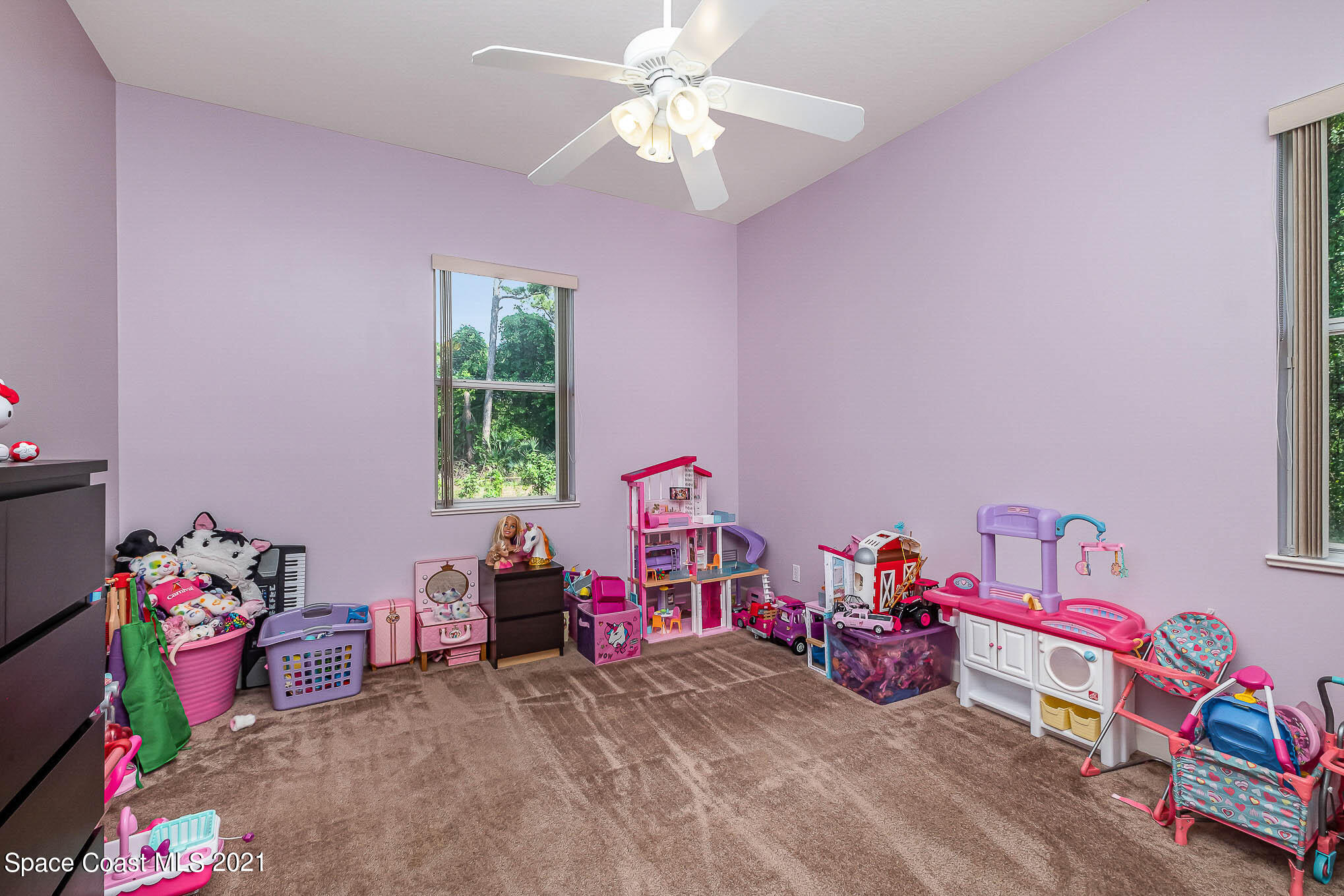 4329 Hunter Road Mims, FL 32754 - Photo 26 of 35 a bedroom with bed and a window