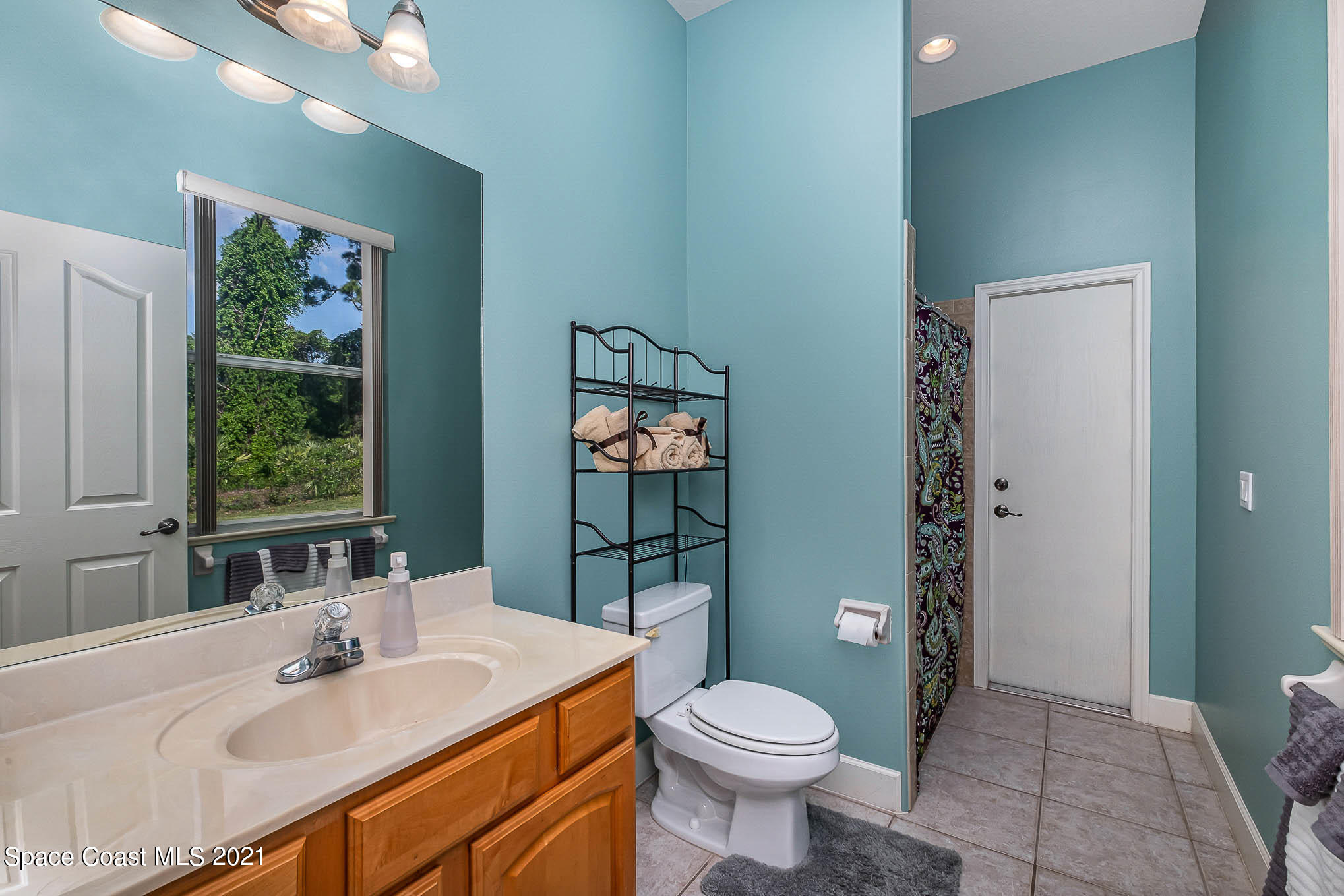4329 Hunter Road Mims, FL 32754 - Photo 28 of 35 a bathroom with a sink a toilet and shower