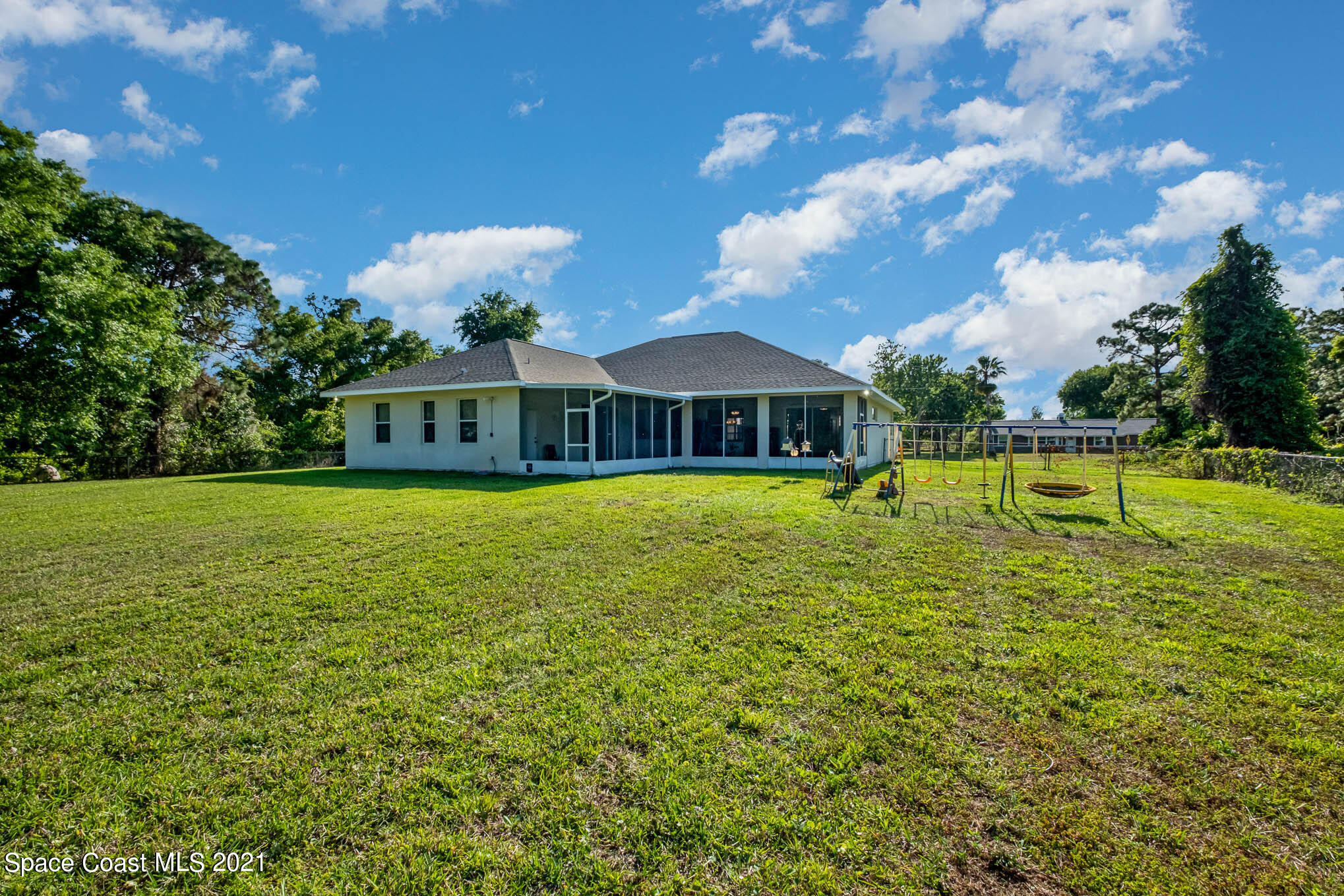 4329 Hunter Road Mims, FL 32754 - Photo 34 of 35 a view of a house with a yard