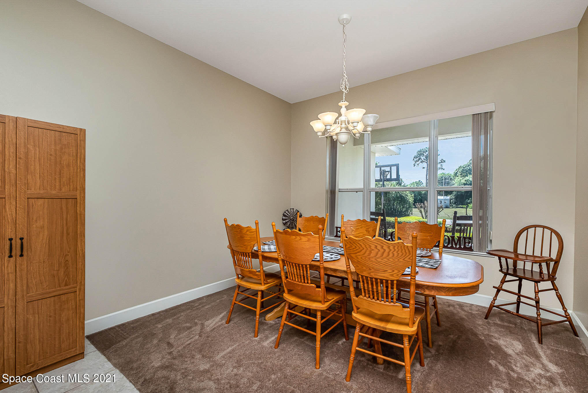4329 Hunter Road Mims, FL 32754 - Photo 6 of 35 a dining room with furniture and chandelier